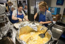 People volunteering at a community kitchen.