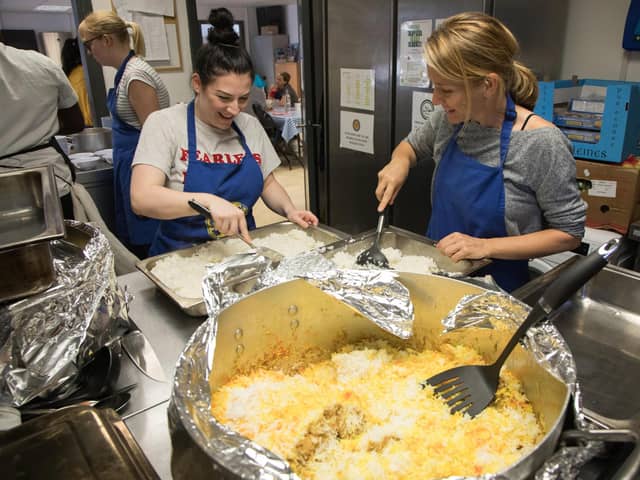 People volunteering at a community kitchen.