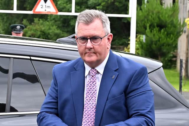 A woman has been arrested and charged with breaching the anonymity of the victims of former DUP leader Jeffrey Donaldson.