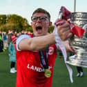 Larne's Levi Ives celebrates with the Gibson Cup. PIC: Andrew McCarroll/ Pacemaker Press