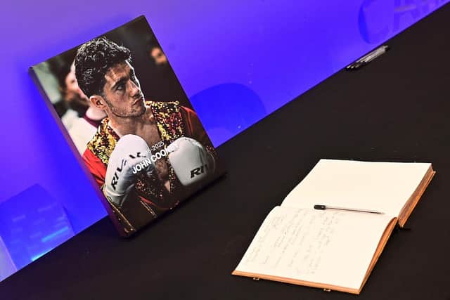 A book of condolence was opened in the Ulster Hall in Belfast to pay tribute to boxer John Cooney following his death a week after a title fight in Belfast.