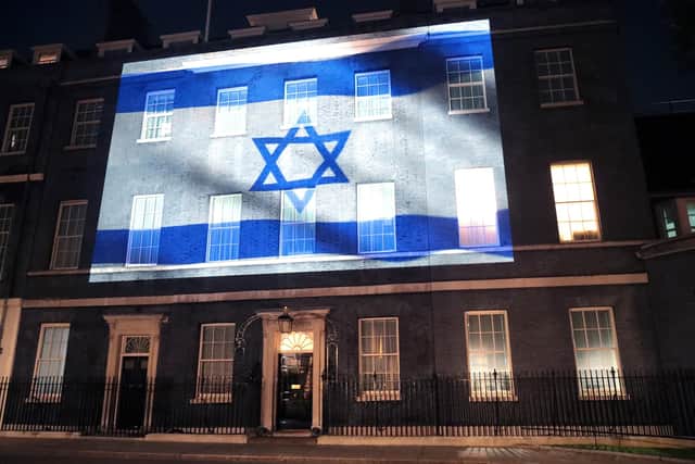 Israel's flag is projected onto the front of 10 Downing Street in a show of support on October 08, 2023 in London.  (Photo by Justin Palmer/Getty Images)