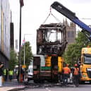 A Glider bus, on the Newtownards Road in east Belfast is removed, after it was set on fire during an anti-immigration demonstration organised in response to a stabbing attack in the city  Picture: Liam McBurney/PA Wire
