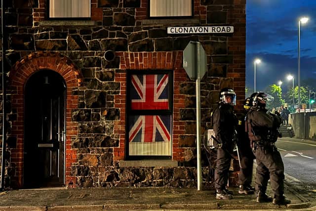 Police officers on Clonavon Road in Ballymena during another night of violence. Photo: Liam McBurney/PA Wire
