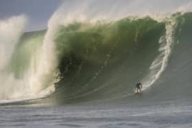 Donegal-born Red Bull athlete Conor Maguire rides a mammoth 40-foot wave which hit Mullaghmore Head in County Sligo this morning following a large swell in the Atlantic Ocean. (Photo by Gary McCall/Red Bull).