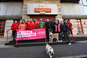 Royal Mail workers at Tomb Street in  Belfast hold the first of 19 strikes in a long-running dispute over pay and conditions.
The Communication Workers Union (CWU) said 115,000 members across the UK would walk out in a 24-hour strike on Thursday, starting at 04:00 BST.
General Secretary Dave Ward said workers faced the "biggest ever assault" on jobs, terms and conditions "in the history of Royal Mail".
Royal Mail said further strikes would "weaken" its financial position.