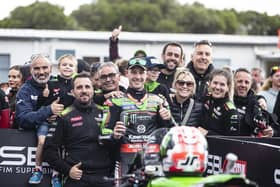 Jonathan Rea with his Kawasaki Racing Team, wife Tatia and sons Jake and Tyler at Phillip Island in Australia on Sunday.