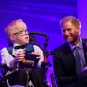 The Duke of Sussex speaks with Blake McCaughey from Tandragee (left) and Hayley Cassin on stage, during the annual WellChild Awards 2023, at the Hurlingham Club in London. 
Photo: Yui Mok/PA Wire
