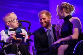 The Duke of Sussex speaks with Blake McCaughey from Tandragee (left) and Hayley Cassin on stage, during the annual WellChild Awards 2023, at the Hurlingham Club in London. 
Photo: Yui Mok/PA Wire