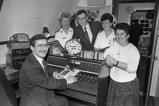 Moyle Hospital Radio’s David Hume receiving a studio clock from British Telecom’s Brian Thompson in January 1992 for winning the Northern Ireland Hospital Radio Award, to the delight of nurses Teresa McGoogan and Jill Hay and Mel Priest of Radio Moyle. Picture: News Letter archives
