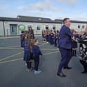 Northern Ireland Education Minister Paul Givan took part in a ceili dance during a visit to Irish language-medium school, Gaelscoil Aodha Rua, in Dungannon this week