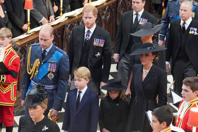 Members of the royal family (left to right, from front) the Prince of Wales, Prince George, Princess Charlotte, the Princess of Wales, the Duke of Sussex, the Duchess of Sussex, Peter Phillips, and the Earl of Snowdon, arriving at the State Funeral of Queen Elizabeth II, held at Westminster Abbey, London. Picture date: Monday September 19, 2022.