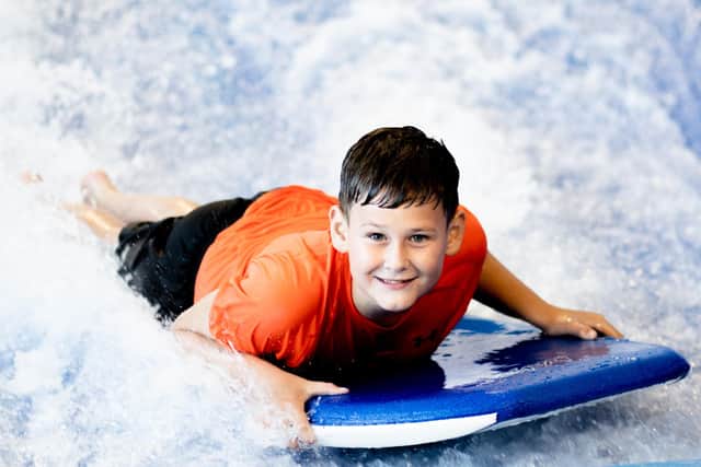 Belfast’s Better leisure centres will open their doors to the public for a weekend of free family activities in celebration of 30 years of GLL. Pictured: A young boy tests out the Surf Simulator at Andersonstown Leisure Centre, Belfast