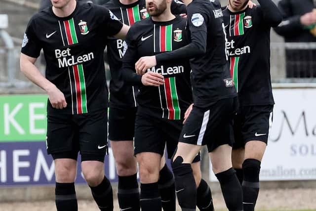 Glentoran's Niall McGinn (centre) following his first goal for the club in the weekend win over Newry City​​​​​​