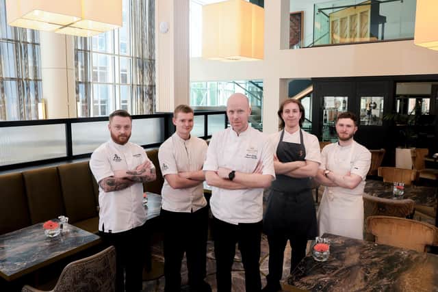 Banbridge's Damian Tumilty now leads the kitchens at both the Europa and Grand Central Hotels — two of Northern Ireland’s most prestigious properties. Damian is pictured with the Europa Hotel’s head chef, Stevie Bracken and head chef of the Causerie Restaurant, Charlie Maguire and the Grand Central Hotel’s chef de partie, Barry Forde and junior sous Chef, Luke Dunbarr