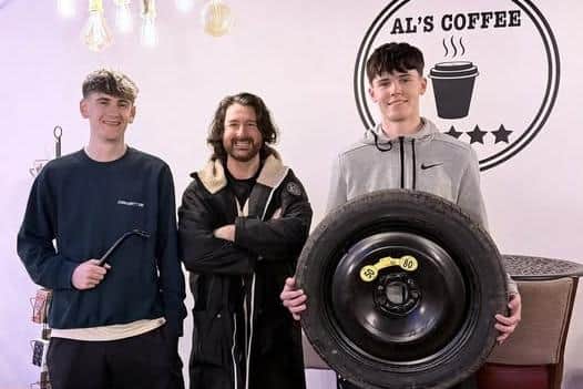 Al’s Coffee which has cafes in Roe Valley Country Park and Castlerock said it was “deeply shocked” after employees discovered their car tyres had been slashed in a random attack near a school in Limavady. Michael Hill pictured presenting employees Josh and Olly with new car tyres