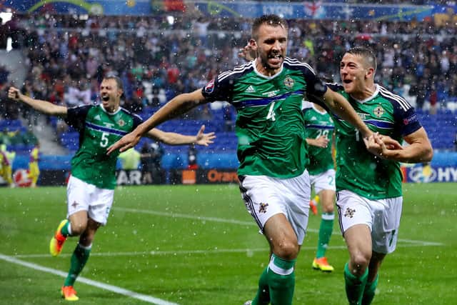 Gareth McAuley celebrates scoring against Ukraine during Northern Ireland's famous Euro 2016 victory at the Stade de Lyon, France. PIC: William Cherry/Presseye