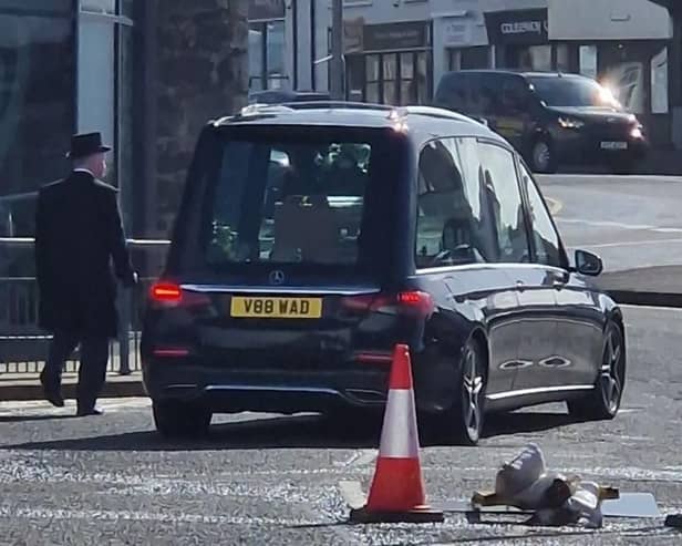 The hearse carrying the remains of the Very Rev RSJ Houston McKelvey OBE QVRM TD, former dean of Belfast, in Portstewart after leaving Agherton Parish church, where his funeral service was held on March 25 2026. Pic: Ben Lowry