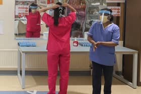Nurses donning PPE at Craigavon Area Hospital in Co Armagh, Northern Ireland.
