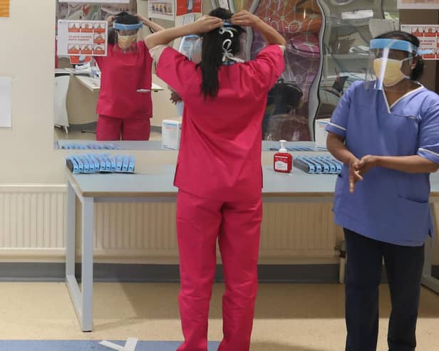 Nurses donning PPE at Craigavon Area Hospital in Co Armagh, Northern Ireland.