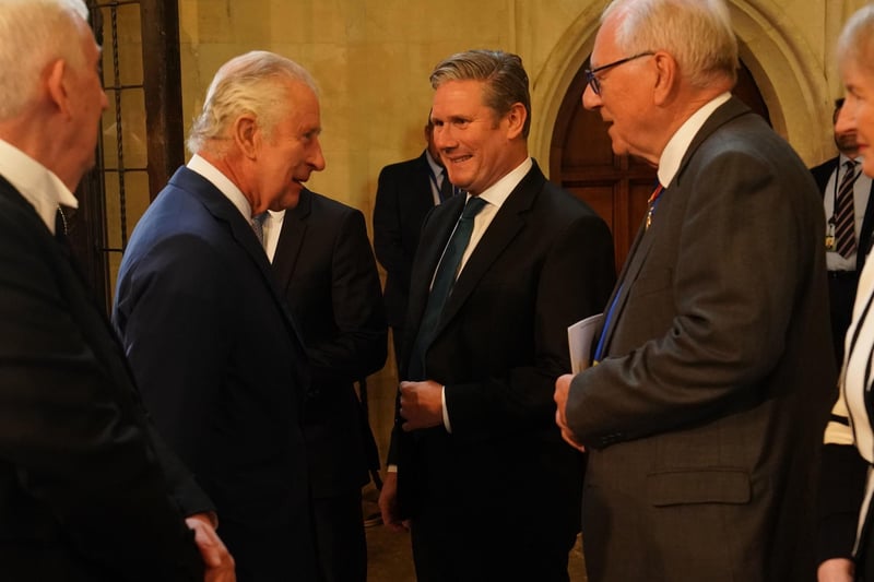 King Charles III speaks with Labour leader Sir Keir Starmer during their visit to Westminster Hall at the Palace of Westminster to attend a reception ahead of the coronation.