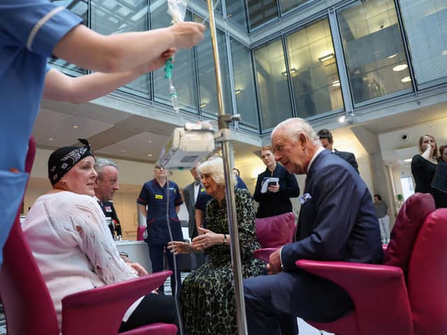 King Charles and Queen Camilla meet with Lesley Woodbridge, a patient receiving the second round of chemotherapy for sarcoma and her husband Roger Woodbridge, during a visit to University College Hospital Macmillan Cancer Centre, London