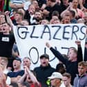 Manchester United fans wave anti-Glazer banners in the stands during a Premier League match at Old Trafford in September.
