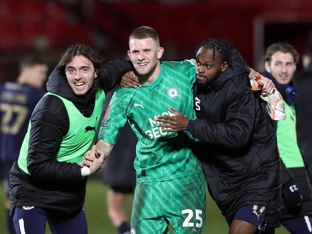 Fynn Talley is congratulated after saving two penalties for Peterborough United in their FA Cup victory over Salford City. PIC: Peterborough United FC