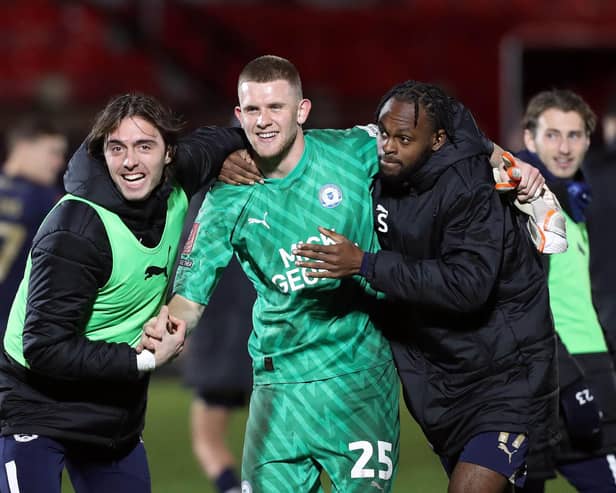 Fynn Talley is congratulated after saving two penalties for Peterborough United in their FA Cup victory over Salford City. PIC: Peterborough United FC