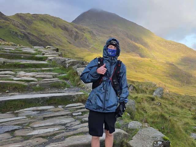 One of the rare occasions the sun came out - Tyler Reid at 6am on Mount Snowdon in Wales during his 36 hour challenge to climb the four highest peaks in the UK.