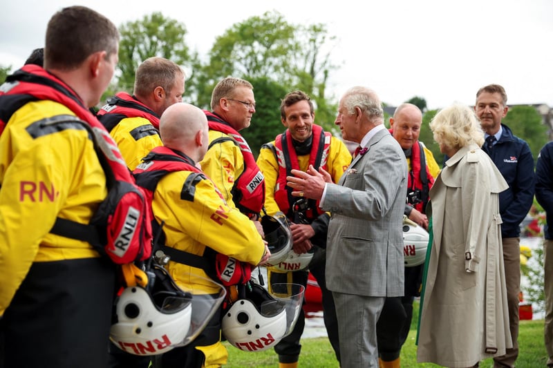 King Charles III and Queen Camilla talk with the members of Royal National Lifeboat Institution as they visit Enniskillen Castle