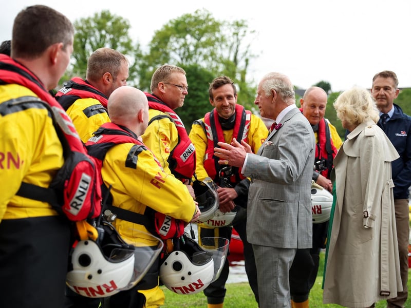 King Charles III and Queen Camilla talk with the members of Royal National Lifeboat Institution as they visit Enniskillen Castle