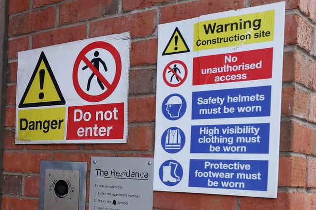 Warnings at the entrance to the defective apartments at Victoria Square in Belfast City Centre. Photo by Jonathan Porter/Press Eye.
