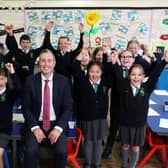 Education Minister Paul Given pictured with pupils from Bangor Central Integrated Primary School. The school is to benefit from a £10 million new build.Photo: Press Eye - Belfast - Darren Kidd