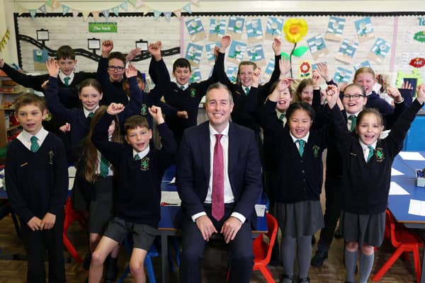 Education Minister Paul Given pictured with pupils from Bangor Central Integrated Primary School. The school is to benefit from a £10 million new build.Photo: Press Eye - Belfast - Darren Kidd