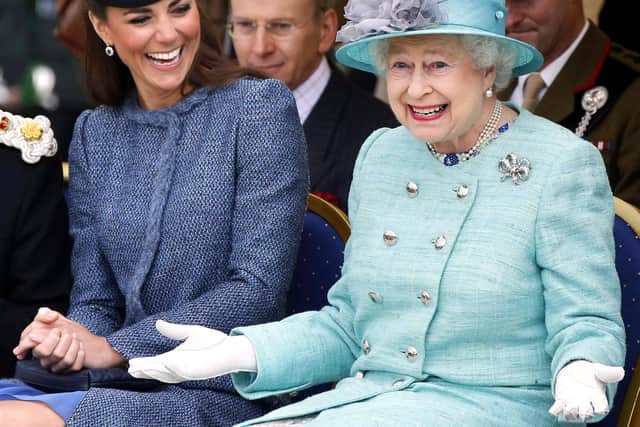 Photo of The Queen and the Duchess of Cambridge laughing