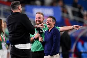 Northern Ireland's Rory McIlroy (right) and golf colleague Shane Lowry enjoying a chat with former Scotland international and current multi-media personality Jim Hamilton ahead of Ireland's Rugby World Cup win over South Africa. (Photo by Laurence Griffiths/Getty Images)