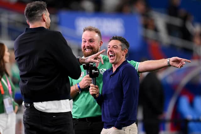 Northern Ireland's Rory McIlroy (right) and golf colleague Shane Lowry enjoying a chat with former Scotland international and current multi-media personality Jim Hamilton ahead of Ireland's Rugby World Cup win over South Africa. (Photo by Laurence Griffiths/Getty Images)