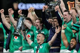 Johnny Sexton, the Ireland captain, holds the Six Nations trophy as Ireland celebrate their Grand Slam victory during the Six Nations Rugby match between Ireland and England.