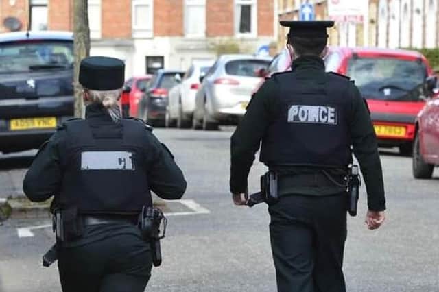 PSNI on foot patrol in south Belfast . Arthur Allison: Pacemaker