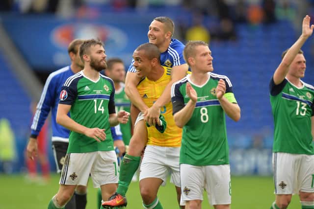 Josh Magennis (second left) celebrating with team-mates after Northern Ireland’s win over Ukraine at EURO 2016. (Photo by Colm Lenaghan/Pacemaker)
