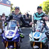 Michael Dunlop celebrates his victory in the first Monster Energy Supersport race at the Isle of Man TT with runner-up Peter Hickman (right) and Dean Harrison