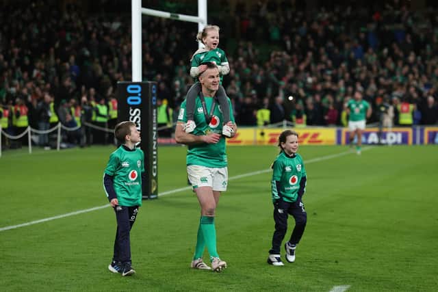 Johnny Sexton, the Ireland captain, celebrates with his children after their Grand Slam victory during the Six Nations Rugby match between Ireland and England at Aviva Stadium.