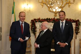 Tanaiste Micheal Martin, President Michael D Higgins and Taoiseach Leo Varadkar at Aras an Uachtarain in Dublin on Saturday