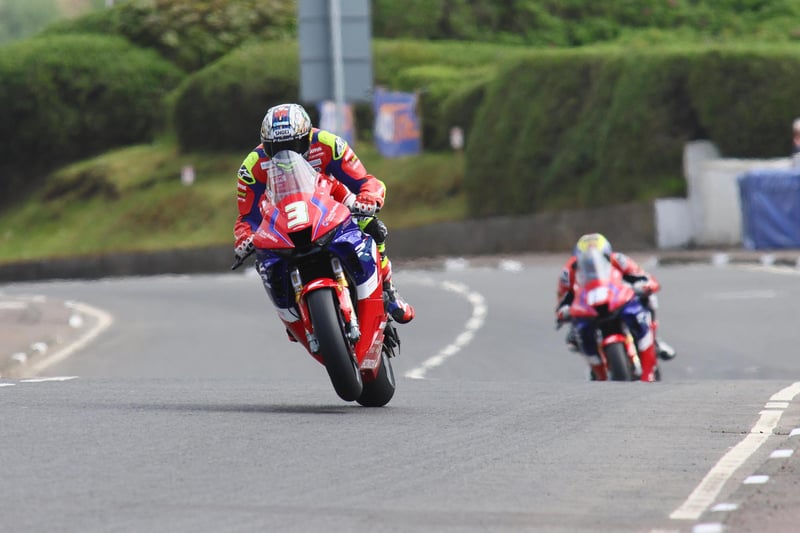 John McGuinness & Nathan Harrison in action during the opening Superstock practice