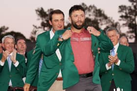 Jon Rahm of Spain is awarded the Green Jacket by 2022 Masters champion Scottie Scheffler of the United States after winning the event in 2023