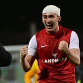 Micheal Glynn - bloodied and bandaged - celebrates after Larne's victory over Glentoran at The Oval, Belfast. PIC: Colm Lenaghan/Pacemaker