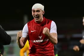 Micheal Glynn - bloodied and bandaged - celebrates after Larne's victory over Glentoran at The Oval, Belfast. PIC: Colm Lenaghan/Pacemaker