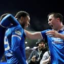 Rangers' Youssef Chermiti (centre) celebrates with John Souttar (right) after scoring the side's fourth goal and his third during the William Hill Premiership match at Ibrox Stadium against Hearts. (Photo by Steve Welsh/PA Wire)