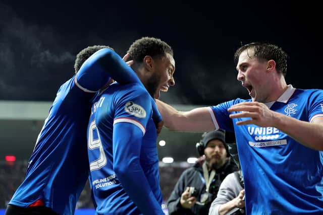 Rangers' Youssef Chermiti (centre) celebrates with John Souttar (right) after scoring the side's fourth goal and his third during the William Hill Premiership match at Ibrox Stadium against Hearts. (Photo by Steve Welsh/PA Wire)